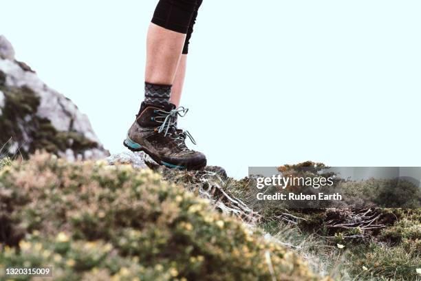 woman hiking, detail on the hiking boots in the mountains - hiking boot stock pictures, royalty-free photos & images