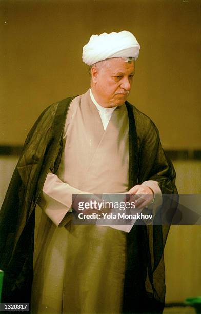 Former president Ali Akbar Hashemi Rafsanjani casts his vote in the presidential election June 8, 2001 in northern Tehran, Iran. President Mohammad...