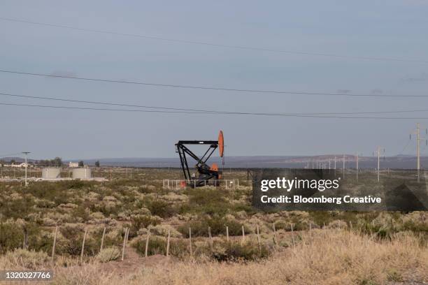 oil pumping jack - plaza huincul stock pictures, royalty-free photos & images