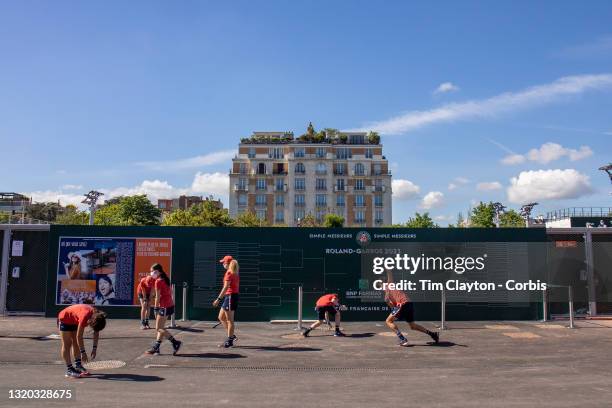 May 27. Ball boys and ball girls warming up on the outside courts during the qualifying tournament at the 2021 French Open Tennis Tournament at...