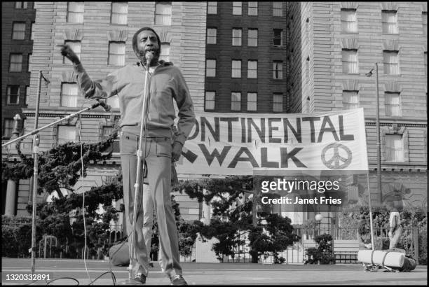 View of American comedian and activist Dick Gregory as he speaks during the Continental Walk Rally in Union Square, San Francisco, California,...