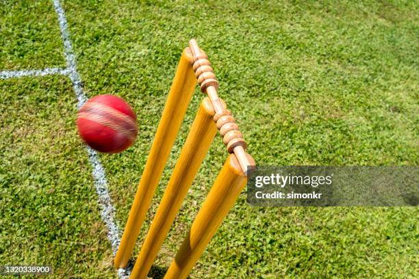 cricket ball approaching stumps - cricket wicket stock pictures, royalty-free photos & images