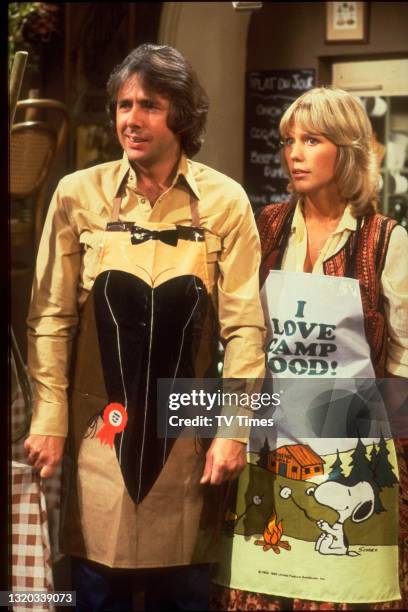 Actors Richard O'Sullivan and Tessa Wyatt in character as Robin Tripp and Vicky Nicholls on the set of sitcom Robin's Nest, circa 1979.