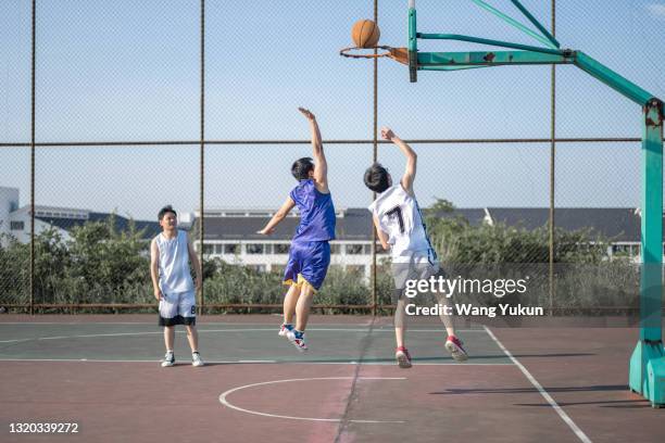 teenagers are playing basketball - moving train hits students stock pictures, royalty-free photos & images