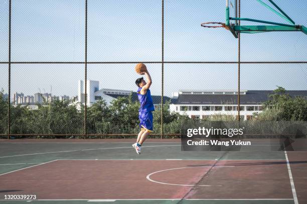 teenagers are playing basketball - moving train hits students stock pictures, royalty-free photos & images