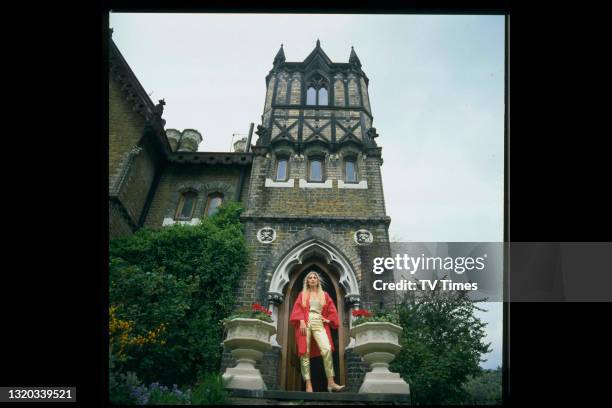 Singer Lynsey De Paul photographed at the entrance to her home, circa 1981.