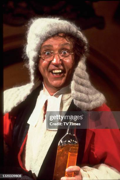 Entertainer Ken Dodd dressed as a drunken judge, circa 1978.