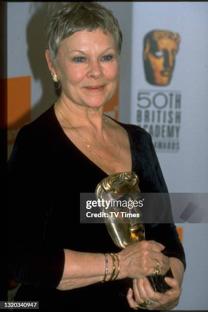 Actress Dame Judi Dench holding her award for Best Actress in a Leading Role at the BAFTA Film Awards, circa 1998.