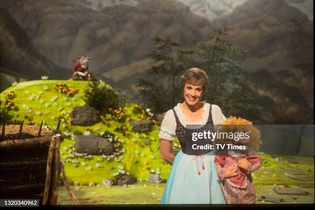 Actress Julie Andrews performing 'The Lonely Goatherd' with puppet character Miss Piggy on the set of The Muppet Show at Elstree Studios,...
