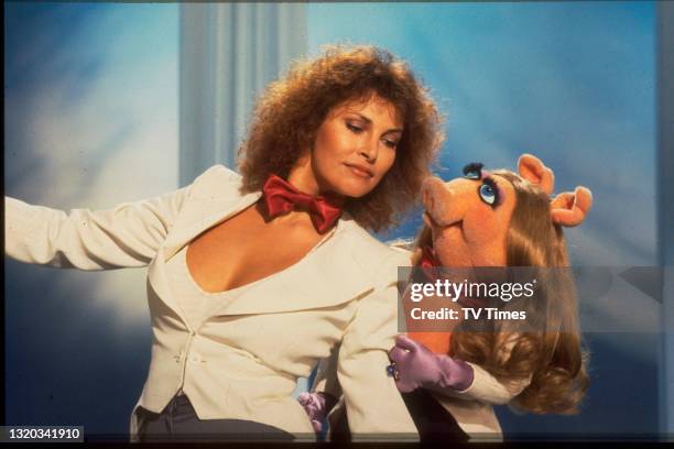Actress Raquel Welch with puppet character Miss Piggy performing the song 'I'm a Woman' on the set of The Muppet Show at Elstree Studios,...