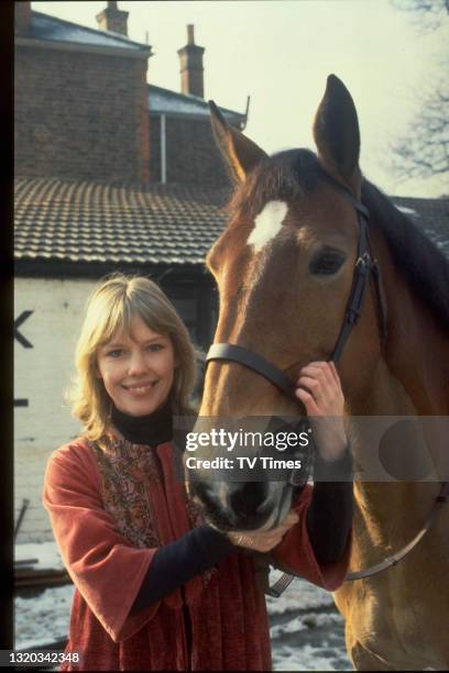 Actress Tessa Wyatt photographed with her horse, circa 1979.