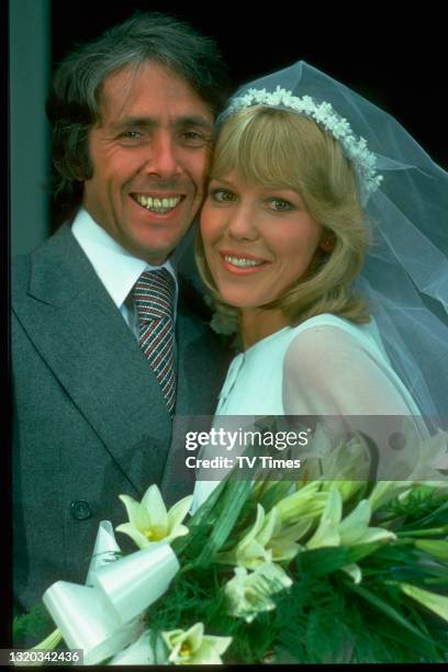 Actors Richard O'Sullivan and Tessa Wyatt in character as Robin and Victoria Tripp while filming a wedding scene in the sitcom Robin's Nest, circa...
