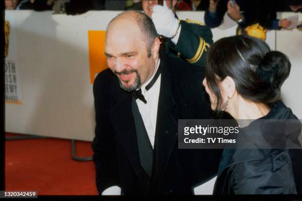 Director Anthony Minghella and his wife Carolyn Choa photographed at the BAFTA Film Awards, circa 1998.