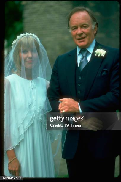 Actors Tony Britton and Tessa Wyatt in character during a wedding scene in the sitcom Robin's Nest, circa 1977.