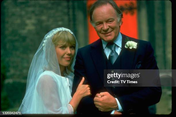 Actors Tony Britton and Tessa Wyatt in character during a wedding scene in the sitcom Robin's Nest, circa 1977.