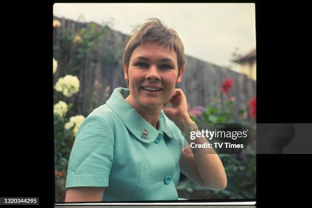 Actress Judi Dench photographed outside in a garden, circa 1968.