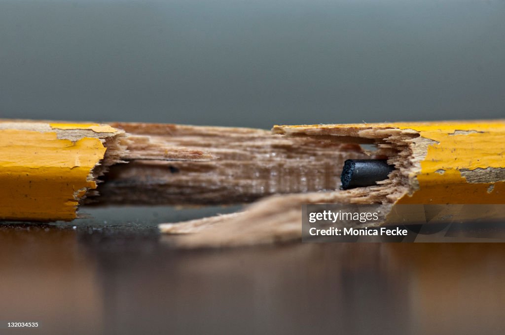 Close up of broken yellow pencil