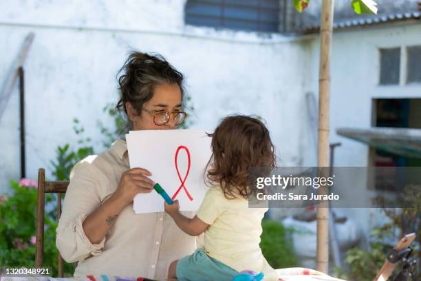 youn latina activist woman working at home - hiv stock pictures, royalty-free photos & images