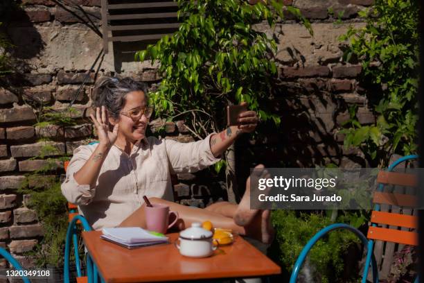 young latina woman taking the sun - showus business stock pictures, royalty-free photos & images