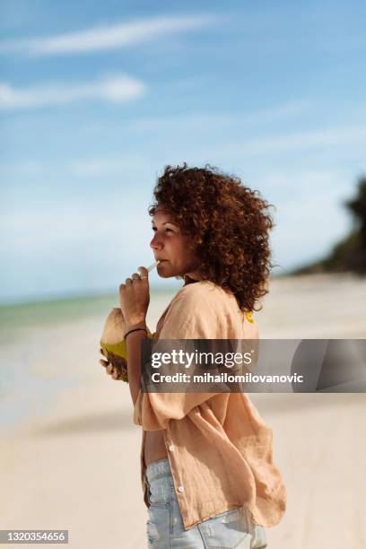 the best kind of therapy is beach therapy - coconut water stock pictures, royalty-free photos & images