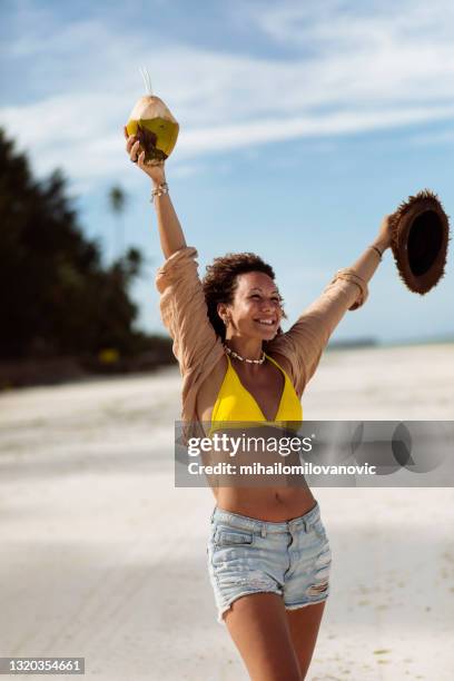 breathe in that ocean air - coconut beach woman stock pictures, royalty-free photos & images