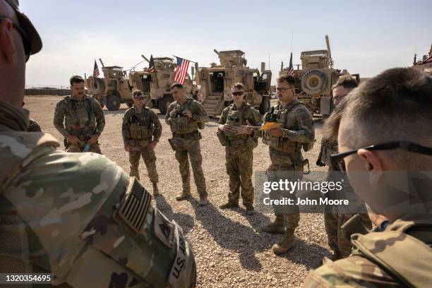 Army soldiers prepare to go out on patrol from a remote combat outpost on May 25, 2021 in northeastern Syria. U.S. Forces, part of Task Force WARCLUB...