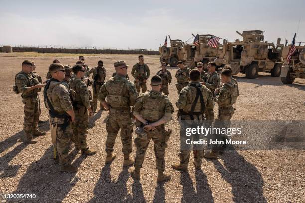 Army soldiers prepare to go out on patrol from a remote combat outpost on May 25, 2021 in northeastern Syria. U.S. Forces, part of Task Force WARCLUB...