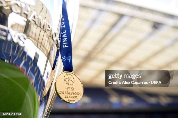 Champions League winners' medal is seen next to the trophy ahead of the UEFA Champions League Final between Manchester City and Chelsea FC at Estadio...