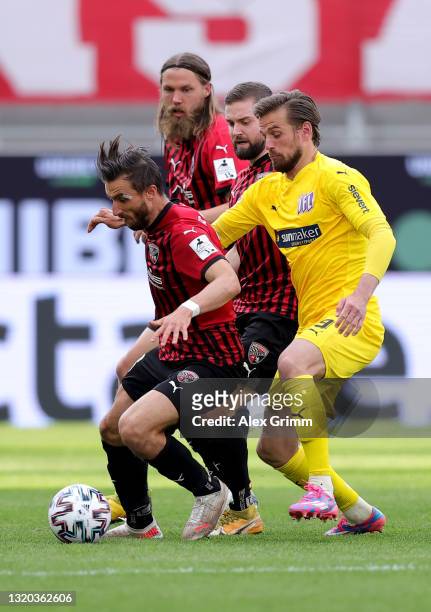 Robin Krauße of FC Ingolstadt challenges Christian Santos of VfL Osnabrück during the 2. Bundesliga playoff first leg match between FC Ingolstadt and...