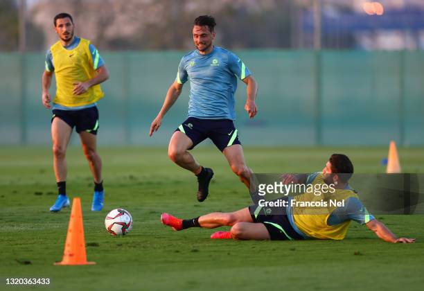 James Holland of Australia is challenged by Brandon Borrello of Australia during an Australian Socceroos training session on May 27, 2021 in Dubai,...