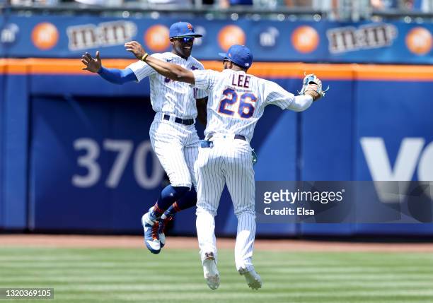 Cameron Maybin and Khalil Lee of the New York Mets celebrate the win over the Colorado Rockies during game one of a double header at Citi Field on...