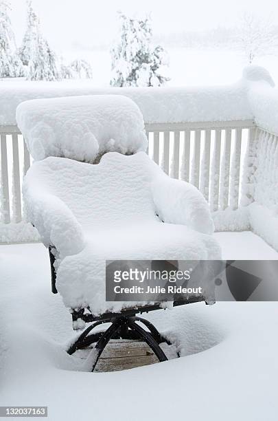 snow covered patio chair - inconvenience stock pictures, royalty-free photos & images