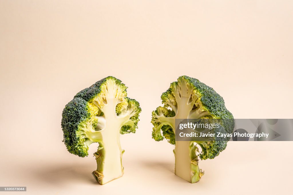 Close-Up Of Sliced Broccoli Against Pastel Background