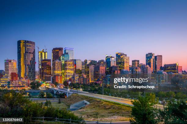 skyline of calgary in canada - calgary stock pictures, royalty-free photos & images