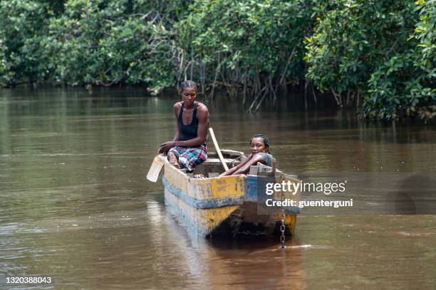 clam (shell) diving on the lower congo river - woman fisherman stock pictures, royalty-free photos & images