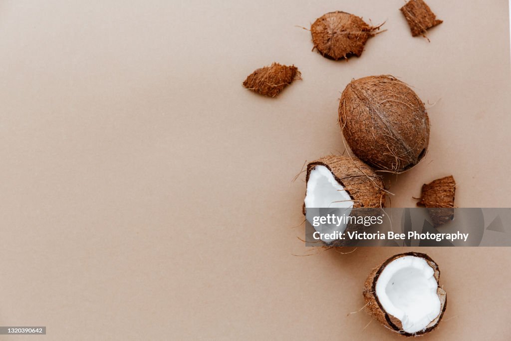 Cracked coconut fruit, Coconut on brown background