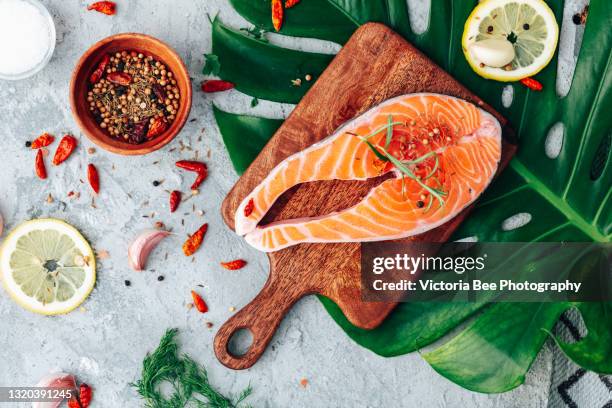 salmon. raw trout red fish steak with ingredients for cooking. cooking salmon, sea food. healthy eating concept - zalm stockfoto's en -beelden