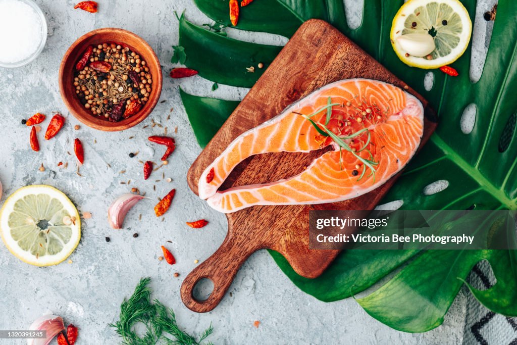 Salmon. Raw trout red fish steak with ingredients for cooking. Cooking Salmon, sea food. Healthy eating concept