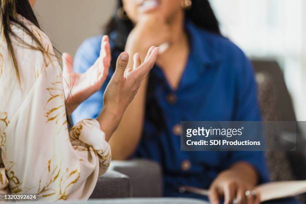 unrecognizable woman talking with therapist - unrecognizable person stock pictures, royalty-free photos & images