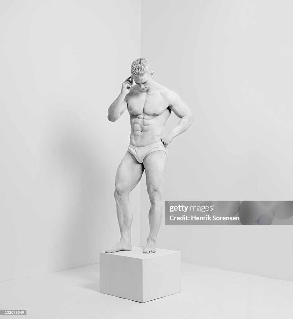 White statue in white room