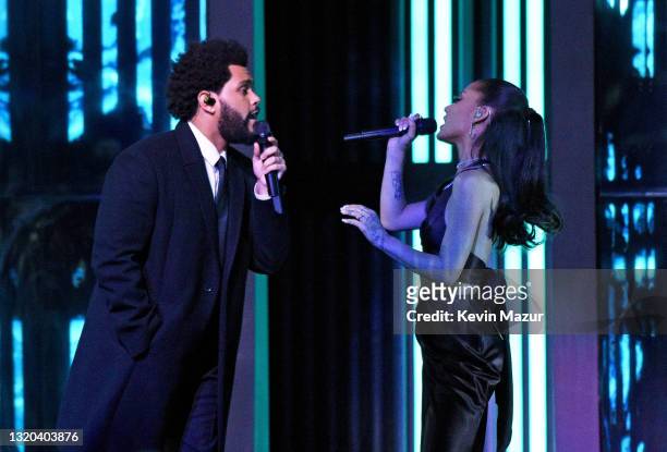 In this image released on May 27, The Weeknd and Ariana Grande perform onstage at the 2021 iHeartRadio Music Awards at The Dolby Theatre in Los...