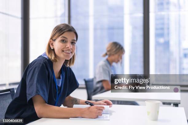 studying hard for a brighter future in the medical industry - degree stock pictures, royalty-free photos & images