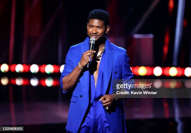 In this image released on May 27, Usher speaks onstage at the 2021 iHeartRadio Music Awards at The Dolby Theatre in Los Angeles, California, which...