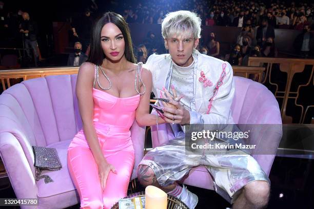 Megan Fox and Machine Gun Kelly attend the 2021 iHeartRadio Music Awards at The Dolby Theatre in Los Angeles, California, which was broadcast live on...