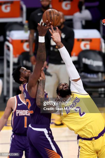 Deandre Ayton of the Phoenix Suns battles Andre Drummond of the Los Angeles Lakers for a rebound during the first half of Game Three of the Western...