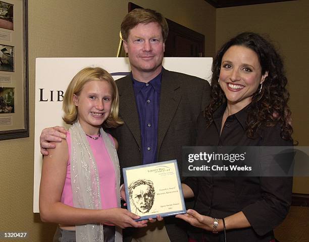 Hanna Kieschnick, from left, Michael Kieschnick, recpient of the "Founders Award," and actress Julia Louis Dreyfuss pose for the photographer at the...