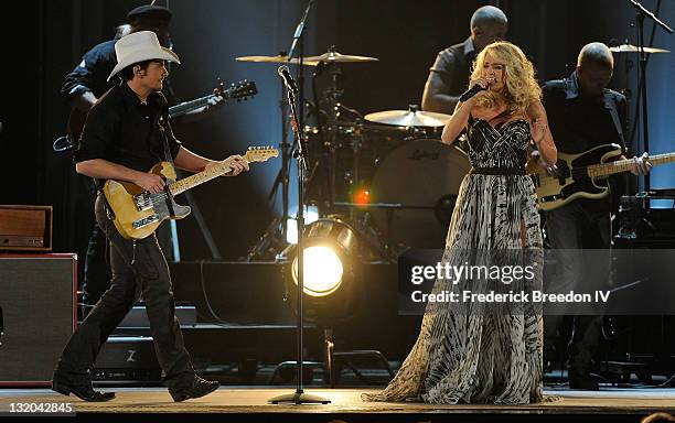 Brad Paisley and Carrie Underwood perform at the 45th annual CMA Awards at the Bridgestone Arena on November 9, 2011 in Nashville, Tennessee.