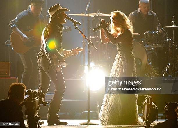 Brad Paisley and Carrie Underwood perform at the 45th annual CMA Awards at the Bridgestone Arena on November 9, 2011 in Nashville, Tennessee.