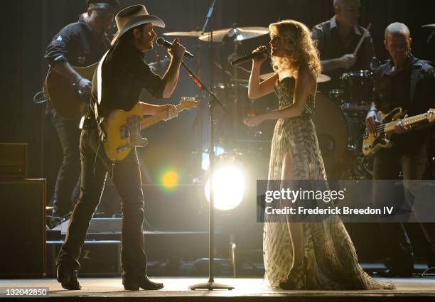 Brad Paisley and Carrie Underwood perform at the 45th annual CMA Awards at the Bridgestone Arena on November 9, 2011 in Nashville, Tennessee.