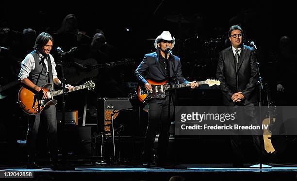 Keith Urban, Brad Paisley, and Vince Gill perform a tribute to Glen Campbell at the 45th annual CMA Awards at the Bridgestone Arena on November 9,...